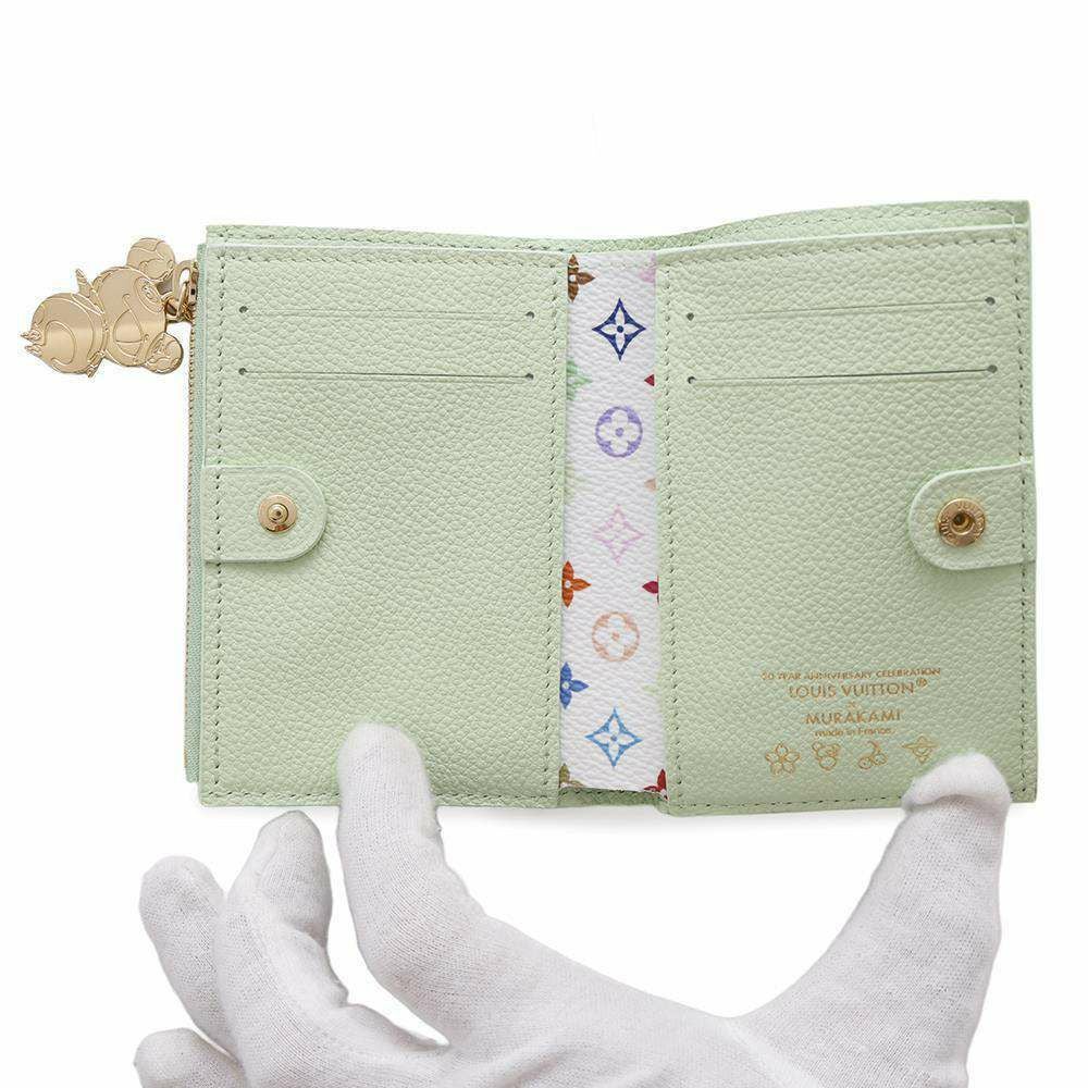 ルイヴィトン 二つ折り財布 モノグラム・アンプラント LV × TM