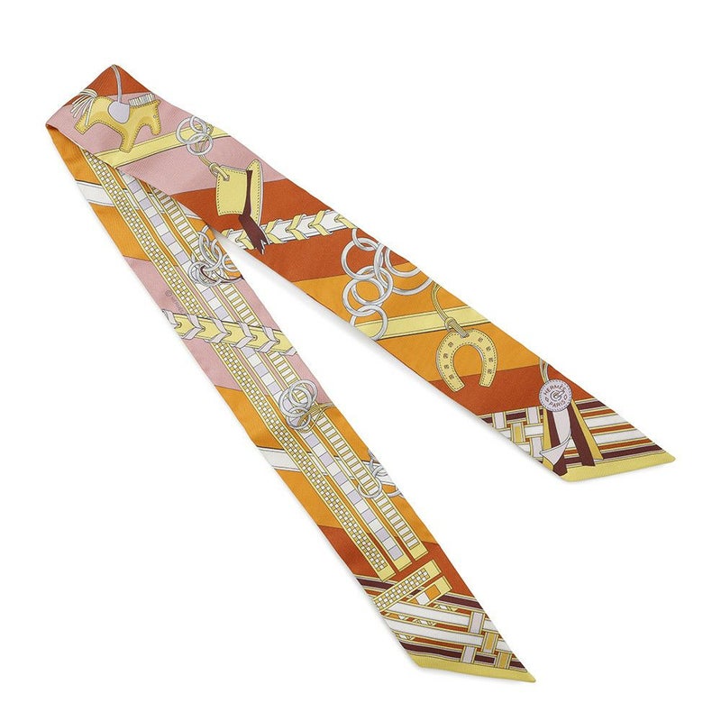 エルメス スカーフ ツイリー 馬勒とチャーム Brides et Gris-Gris HERMES シルクツイル 2023春夏